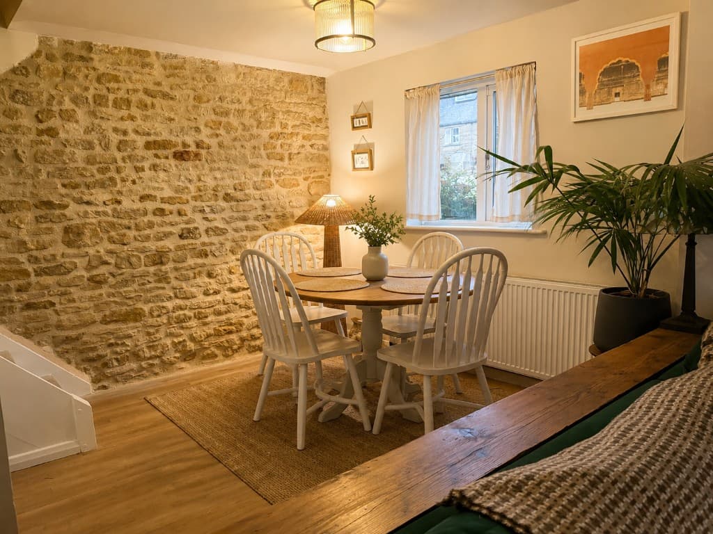 Dining area with original stone wall